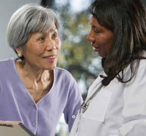 Woman talking with healthcare provider.